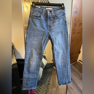 Woman’s Levis Wedgie Straight jeans in size 24 with multi button fly closure